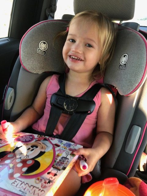 Ava being entertained with toddler car activities