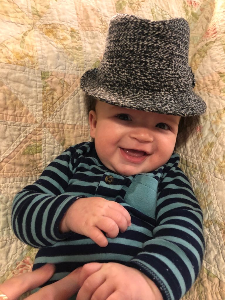 picture of baby with hat - children's books about hats
